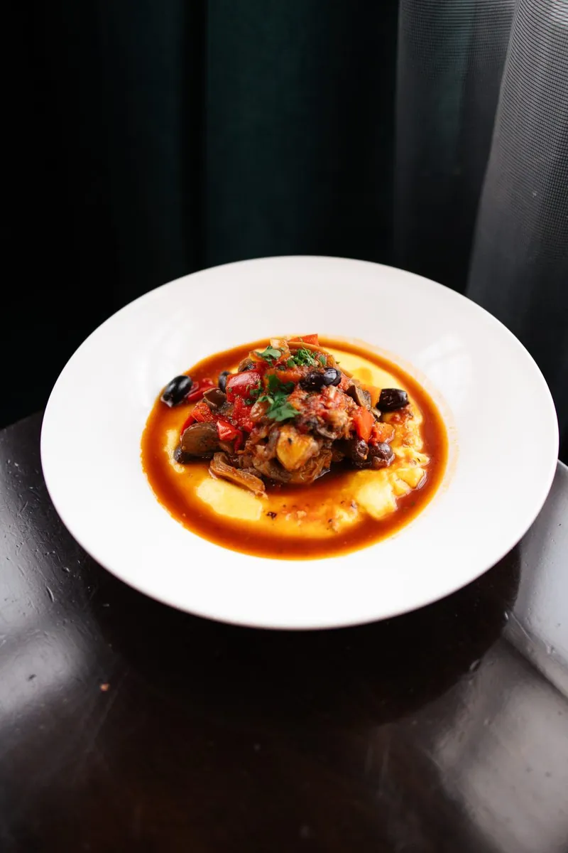 Chicken cacciatore with peppers, olives and soft polenta