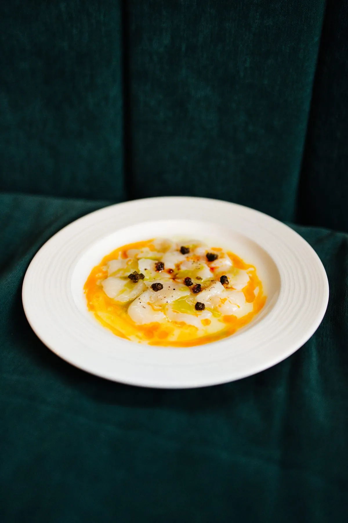 Scallop crudo with capers and chilli oil at Tulia Osteria