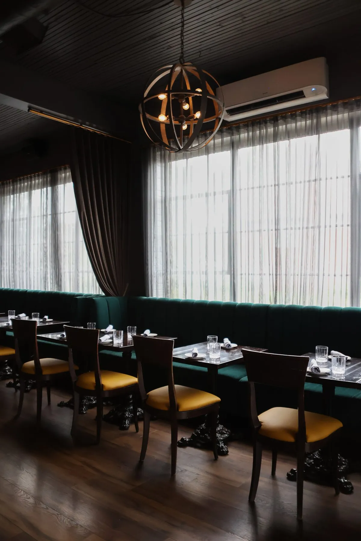 Emerald banquettes in the dining room at Tulia Osteria