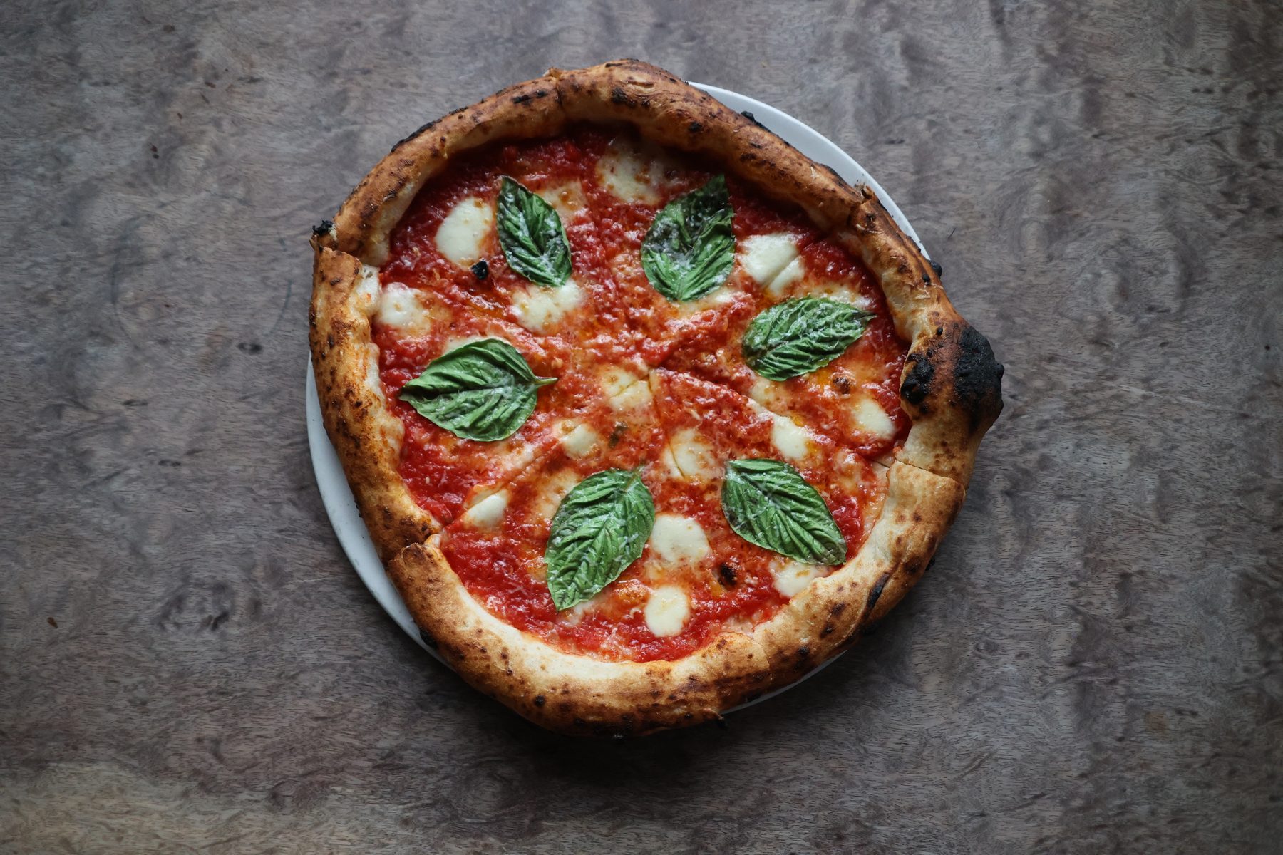 A Neapolitan margherita pizza from the wood oven at Tulia Osteria, Toronto