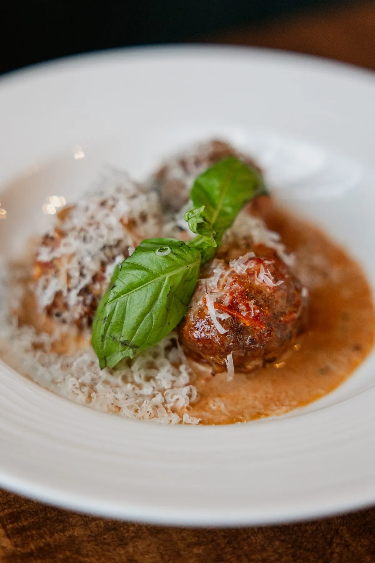 Beef, pork and veal meatballs with garlic marinara and basil