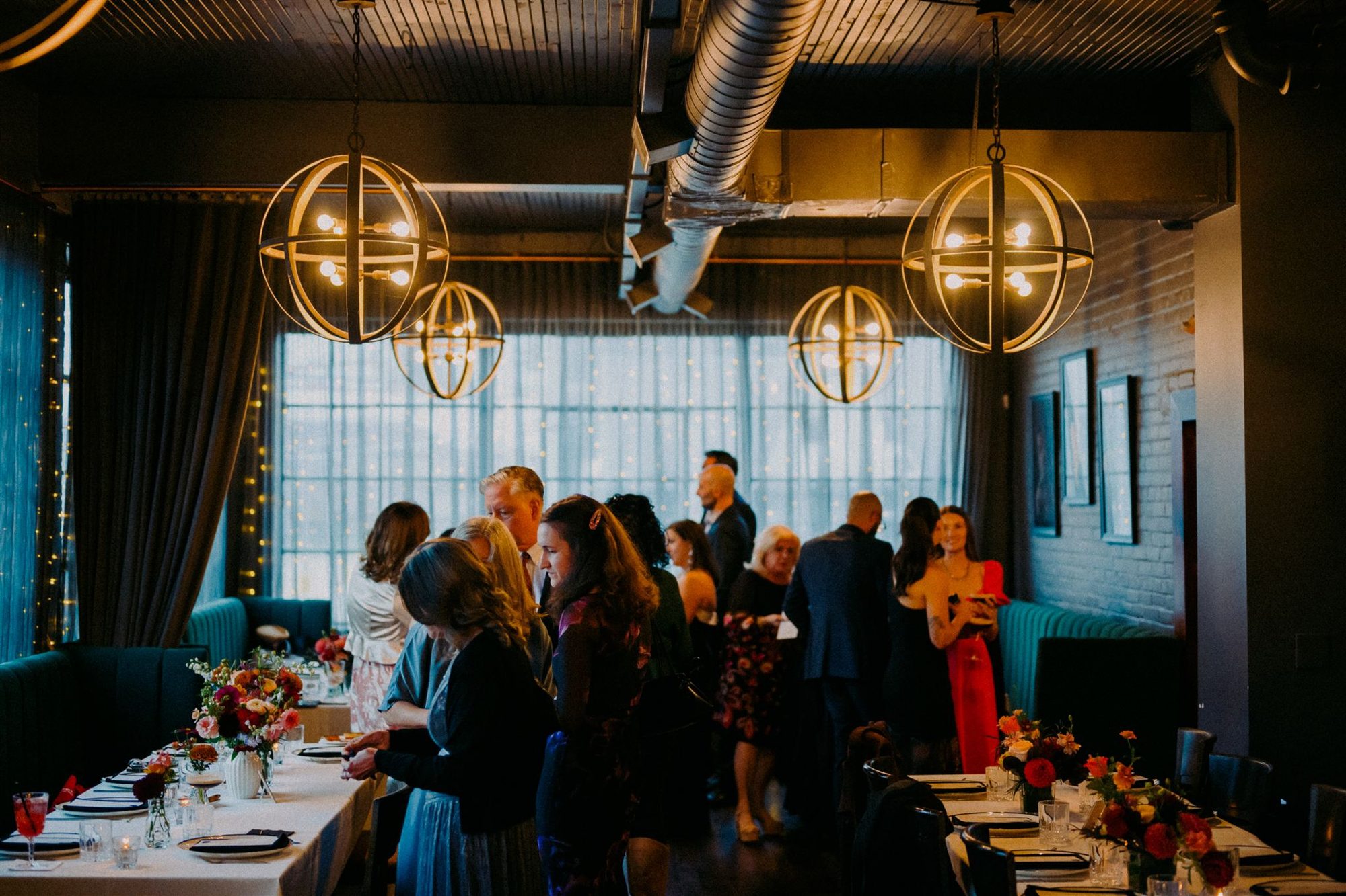 Guests at a private event in the dining room at Tulia Osteria, Toronto