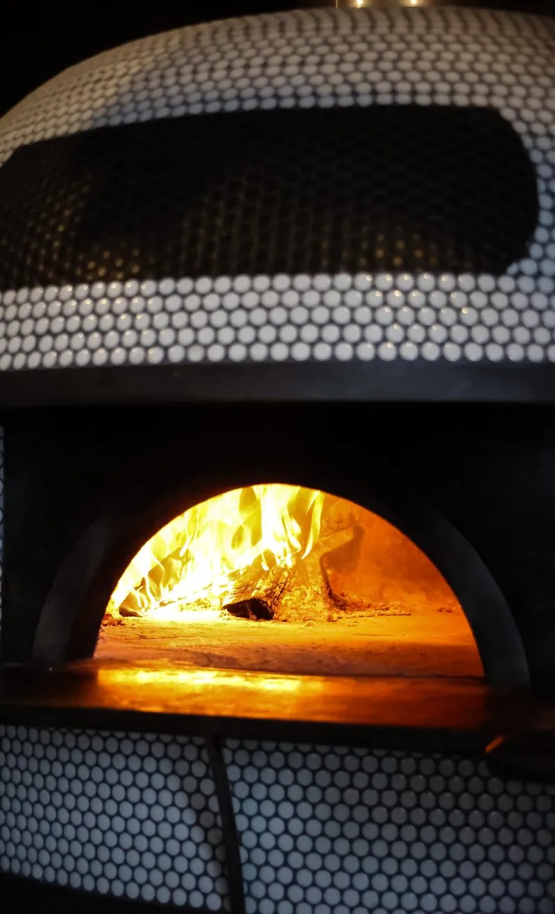 Live fire in the wood-fired oven at Tulia Osteria